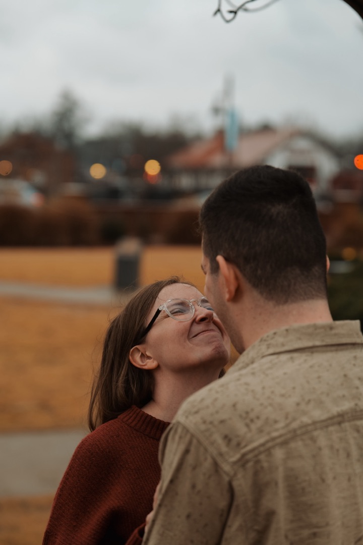 Couple laughing with bokeh lights