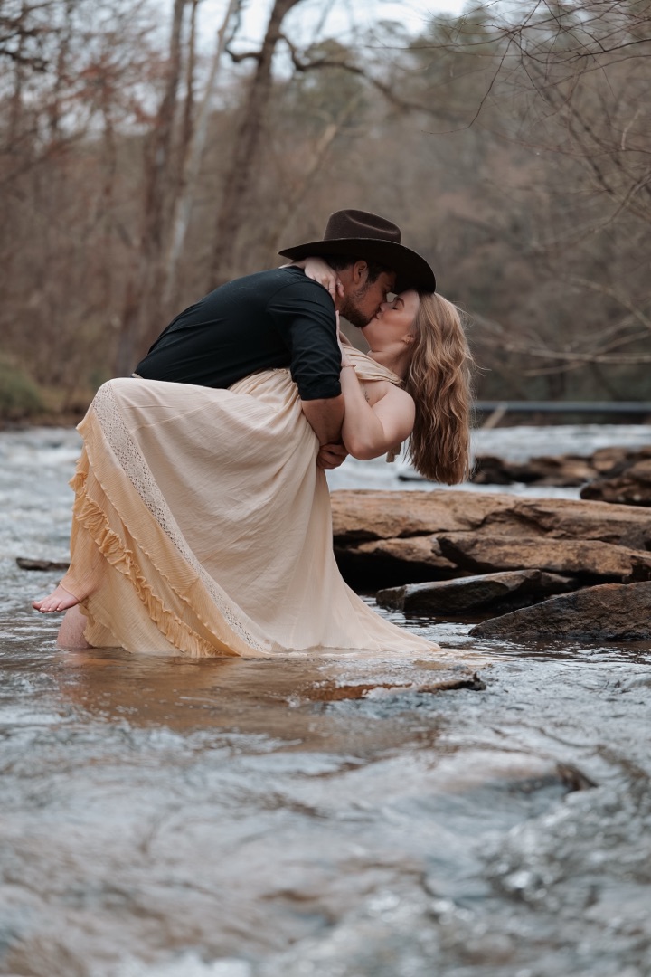 Couple kissing in a river